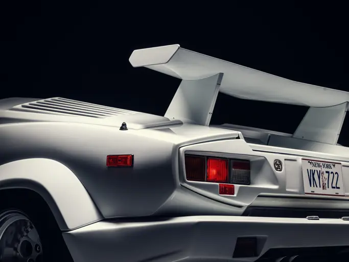 The white 1989 Lamborghini Countach 25th Anniversary (chassis KLA12722) driven by Leonardo DiCaprio in *The Wolf of Wall Street* (2013), auctioned by RM Sotheby's in December 2023 for $1.655 million, a record for the 25th Anniversary specification.